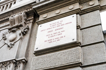 Wall Mural - Commemorative plaque pointing the house where American writer Ernest Hemingway stayed in via Armorari, Milano city center, Italy