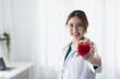 © Wasan - Portrait of female doctor and care concept for heart patients.