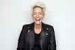 Portrait of a beautiful young woman laughing while wearing a leather jacket