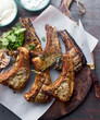 © Darren Muir/Stocksy - Garlic and rosemary lamb chops with cilantro marinade