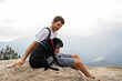 © Alba Vitta/Stocksy - Man and dog at viewpoint nature
