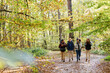 © Oleksii Syrotkin/Stocksy - Active tourists walking nature autumn forest