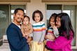 © Erin Brant/Stocksy - Authentic happy asian family laughing and hugging together