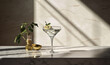  a martini glass with an olive garnish and a bottle of gin.  generative ai