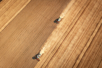 Fototapete - Aerial view combine harvester harvesting on the field.