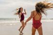 © Eloísa Ramos/Stocksy - Happy girls at the beach in summer