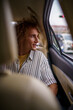© Jovo Jovanovic/Stocksy - Entrepreneur heading to airport in private car
