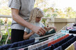 © Tanya Yatsenko/Stocksy - Father with daughter doing laundry on the balcony