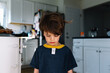 © Maria Manco/Stocksy - Sad boy with clothes on wrong way