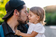 © Maria Manco/Stocksy - Dad give young daughter affection