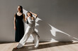 © Tania Cervian/Stocksy - Confident ballerina dancing with partner in studio