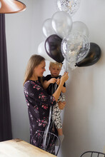 Boy ,mother With Baloons