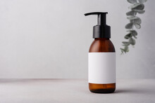 Brown Glass Bottle With Eucalyptus For Cosmetic Product Mock Up