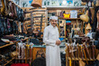 © Daniel Gonzalez/Stocksy - Calm man in traditional oriental clothes in workshop