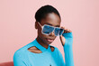 © Sergey Filimonov/Stocksy - Woman wearing cool blue sunglasses