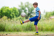 Young boy during exercises football