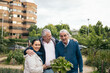 © Pedro Merino/Stocksy - People in an urban orchard