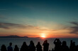 © Ibai Acevedo/Stocksy - Group of people enjoying sunset sea view
