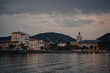 © Ivan Haidutski/Stocksy - Serene sunset over Como Lake with twinkling city lights