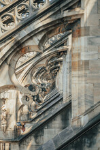 Close-up view arch of Milan Duomo, optical illusion of endless beauty