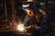 © VisualProduction - A woman working as an industrial welder, focus on work, wearing safety gear. Generative AI