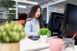 © Santi Nuñez/Stocksy - Focused asian woman Working In A Modern Office