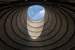 © Nibuya Qubik/Stocksy - View from inside of top cooling tower hole of an abandoned power plant