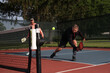 © Ron Alvey/Stocksy - pickelball played by seniors