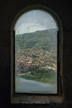 View On A Small Towm Trough Ancient Window