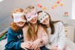 © Lightsy/Stocksy - Three girls with sleep masks