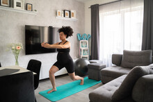 Pregnant Woman Doing Sport At Home