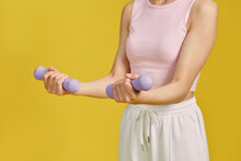 Happy Fit Woman Doing An Exercise With Dumbbell