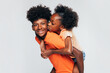 © VICTOR TORRES/Stocksy - Cheerful black girl hugging brother