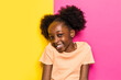 © VICTOR TORRES/Stocksy - Cheerful black girl looking at camera