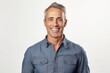 © igolaizola - Portrait of handsome middle-aged man smiling at camera over white background