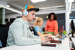 © Santi Nuñez/Stocksy - Focused young man Working In A Modern Office