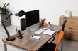 © New Africa - Stylish director's workplace with comfortable furniture, computer and accessories in office. Interior design