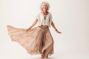 Poster - Full length portrait of a happy senior woman laughing and dancing isolated over white background