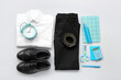 © Pixel-Shot - Stylish school uniform with alarm clock and stationery on grey background