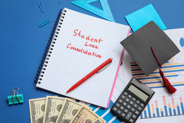 Wall Mural - Notebook with text STUDENT LOAN CONSOLIDATION, dollar banknotes, graduation cap, calculator and stationery on blue background