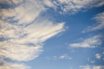 Wall Mural - blue sky with cloud closeup. Beautiful nature background with clouds.