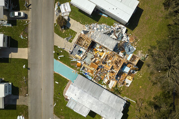 Poster - Severely damaged houses after hurricane Ian in Florida mobile home residential area. Consequences of natural disaster