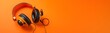 Orange headphones, Retro old-fashioned headphones on vibrant orange background with copy space, Generated AI