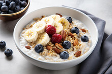 Oat Porridge With Banana, Blueberry, Walnut, Chia Seeds And Almond Milk For Healthy Breakfast Or Lunch. 