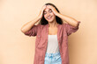 © luismolinero - Young woman isolated on beige background laughing