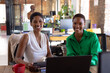 © Wavebreak Media - Portrait of happy african american colleagues using tablet in creative office