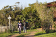 © Wavebreak Media - Senior african american couple with backpacks walking in sunny nature
