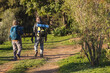 © Wavebreak Media - Senior african american couple with backpacks walking in sunny nature