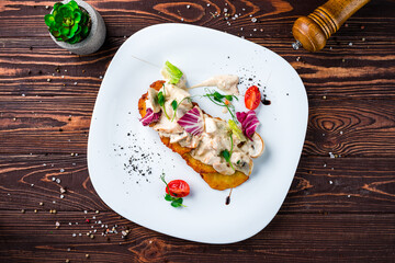 Sticker - Potato pancakes with chicken fillet and mushrooms in cream sauce, tomatoes and lettuce, dinner.