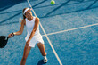 © Jacob Lund - Woman receiving a shot from her opponent on a padel court
